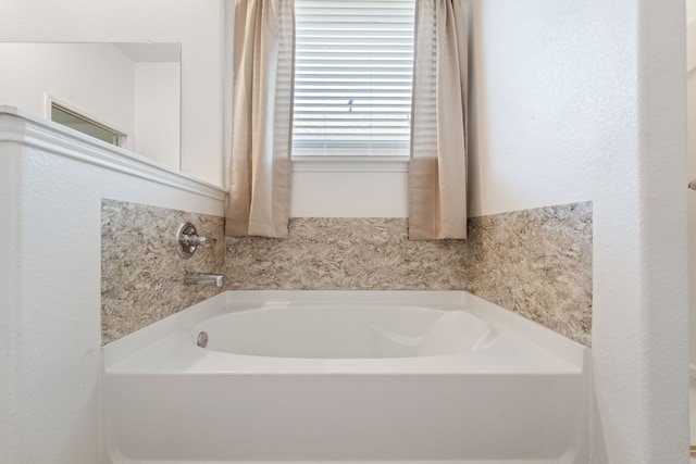 10750 Nathaniel Valley Path, Houston, TX 77016 - bathroom featuring a garden tub