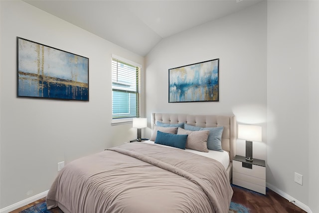 10750 Nathaniel Valley Path, Houston, TX 77016 - bedroom with vaulted ceiling and dark wood-style floors