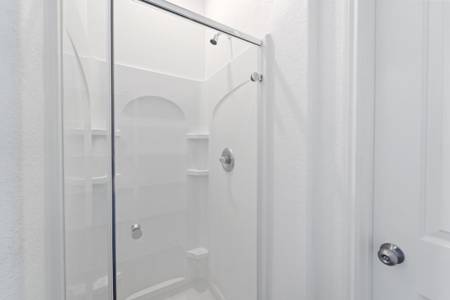 10750 Nathaniel Valley Path, Houston, TX 77016 - bathroom featuring a stall shower