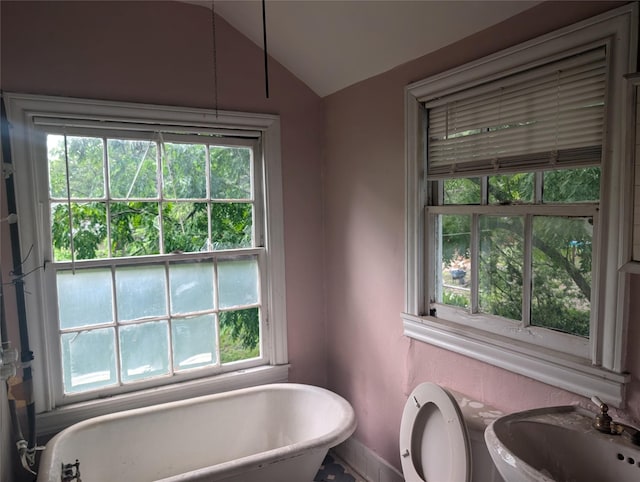 8343 Bonner, Houston, TX 77017 - bathroom with a freestanding tub, healthy amount of natural light, and vaulted ceiling