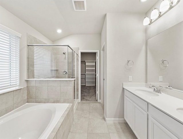 21622 Teton Rock Trl, Richmond, TX 77407 - full bathroom with a shower stall, a bath, double vanity, plenty of natural light, and lofted ceiling