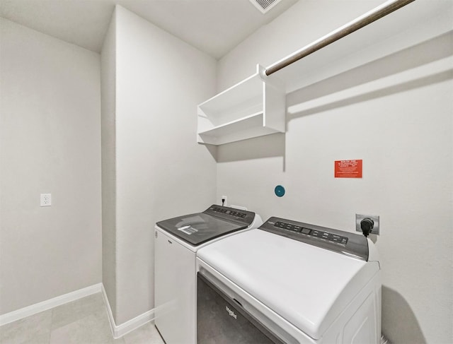21622 Teton Rock Trl, Richmond, TX 77407 - laundry area featuring washing machine and dryer and baseboards