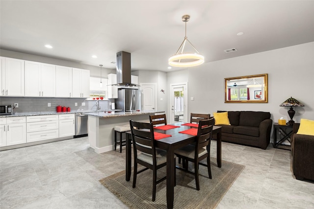 224 Evergreen Dr, Huntsville, TX 77340 - dining room featuring recessed lighting and plenty of natural light