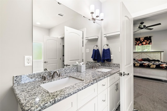 224 Evergreen Dr, Huntsville, TX 77340 - ensuite bathroom featuring double vanity and a ceiling fan