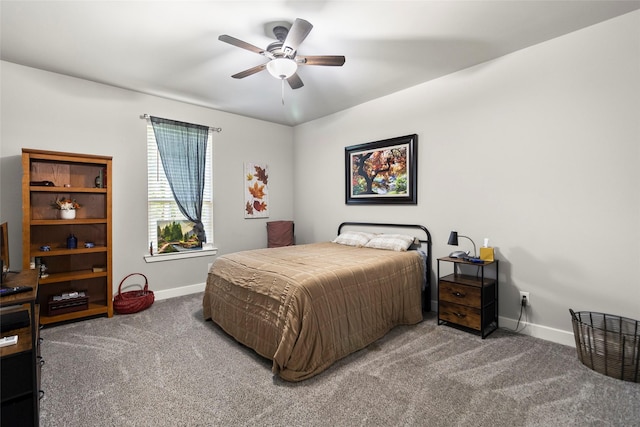 224 Evergreen Dr, Huntsville, TX 77340 - carpeted bedroom featuring baseboards and ceiling fan