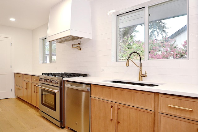 5330 Dumfries Dr, Houston, TX 77096 - kitchen with stainless steel appliances, custom exhaust hood, backsplash, light countertops, and recessed lighting