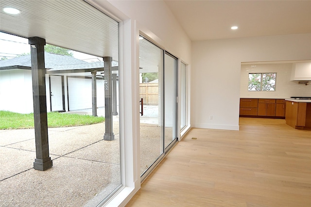 5330 Dumfries Dr, Houston, TX 77096 - doorway to outside with light wood finished floors and recessed lighting