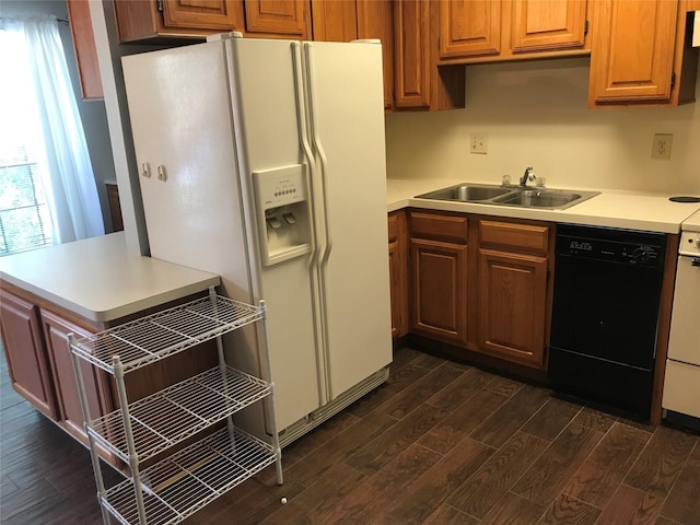 1311 Antoine Dr Unit 159, Houston, TX 77055 - kitchen featuring black dishwasher, white fridge with ice dispenser, dark wood-type flooring, light countertops, and brown cabinets