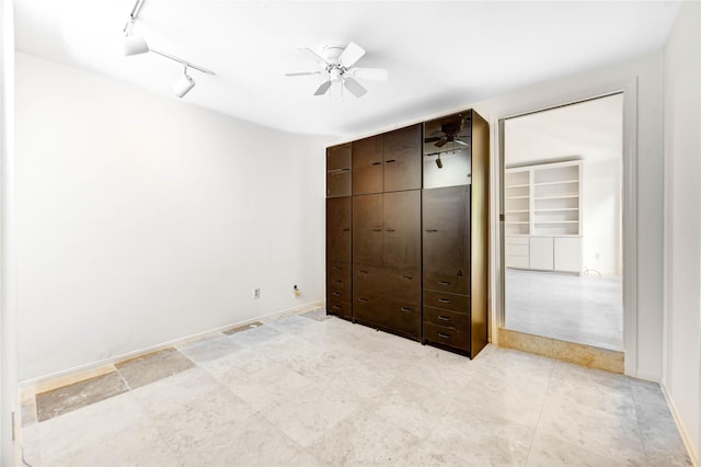 3831 Wood Stone Walk Dr, Houston, TX 77084 - unfurnished bedroom with rail lighting and a ceiling fan