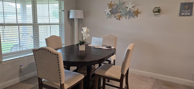 5311 New Iberia Ln, Dickinson, TX 77539 - dining room featuring carpet floors and plenty of natural light