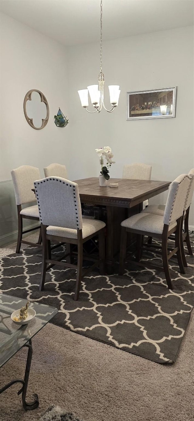 5311 New Iberia Ln, Dickinson, TX 77539 - dining space featuring carpet flooring and a chandelier
