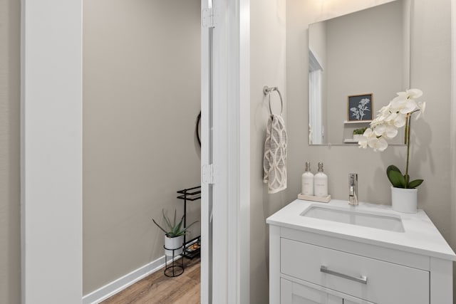 413 Stonework Oaks Ln, Houston, TX 77076 - bathroom with vanity and wood finished floors