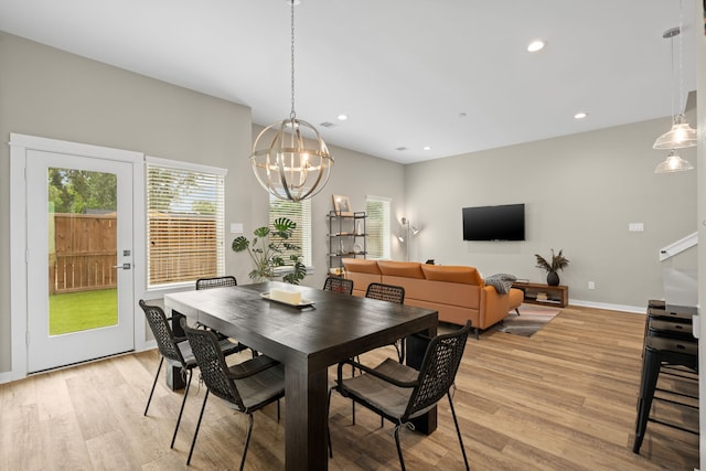 413 Stonework Oaks Ln, Houston, TX 77076 - dining space with light wood finished floors, plenty of natural light, a chandelier, and recessed lighting