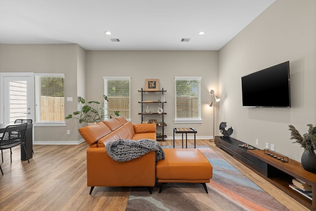 413 Stonework Oaks Ln, Houston, TX 77076 - living room with light wood-style flooring and recessed lighting