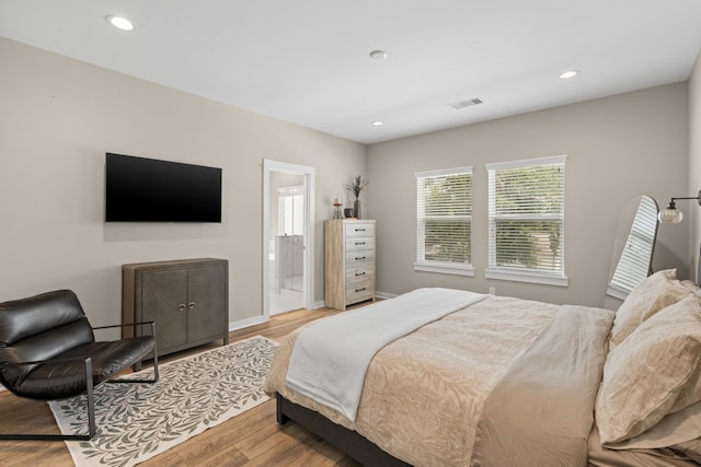 413 Stonework Oaks Ln, Houston, TX 77076 - bedroom featuring wood finished floors and recessed lighting
