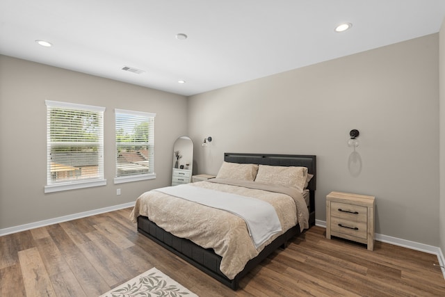 413 Stonework Oaks Ln, Houston, TX 77076 - bedroom featuring wood finished floors and recessed lighting