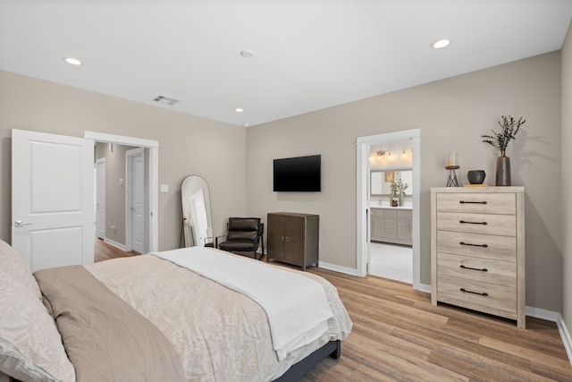 413 Stonework Oaks Ln, Houston, TX 77076 - bedroom featuring light wood-style flooring, recessed lighting, and ensuite bathroom