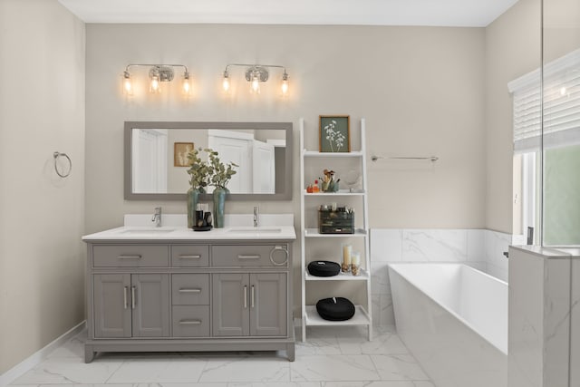 413 Stonework Oaks Ln, Houston, TX 77076 - bathroom featuring marble look tile flooring, a freestanding tub, and double vanity