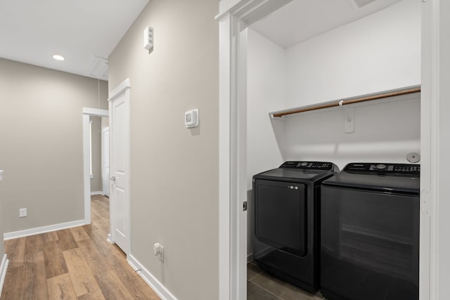 413 Stonework Oaks Ln, Houston, TX 77076 - washroom featuring washing machine and dryer, recessed lighting, and light wood-style floors