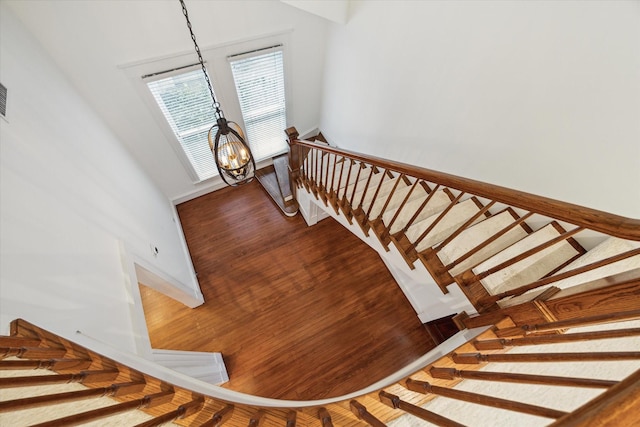 208 E 12th St, Houston, TX 77008 - stairs featuring wood finished floors and a chandelier