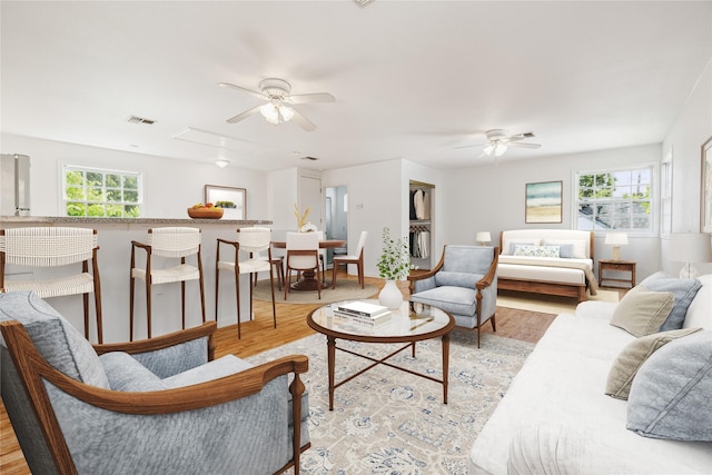 208 E 12th St, Houston, TX 77008 - living area with a ceiling fan, light wood-style floors, and attic access