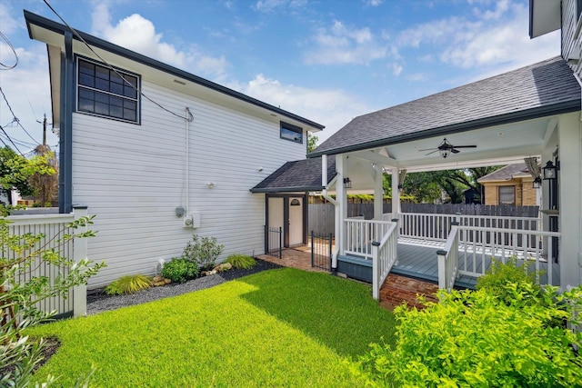 208 E 12th St, Houston, TX 77008 - back of property with ceiling fan, a deck, and a shingled roof