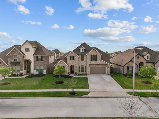 706 Westwood Dr, League City, TX 77573 - french country style house featuring driveway, a residential view, and brick siding