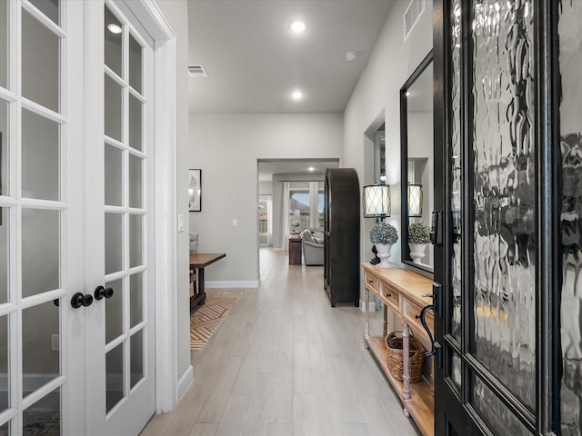 706 Westwood Dr, League City, TX 77573 - hall with french doors, light wood finished floors, and recessed lighting