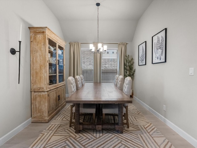 706 Westwood Dr, League City, TX 77573 - dining room featuring a chandelier, lofted ceiling, and light wood-type flooring