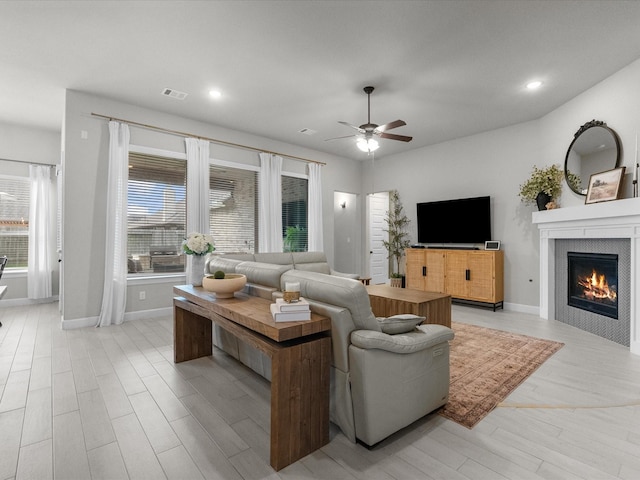 706 Westwood Dr, League City, TX 77573 - living area featuring a ceiling fan, light wood-style floors, a fireplace, and recessed lighting