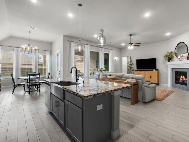 706 Westwood Dr, League City, TX 77573 - kitchen with a ceiling fan, stone countertops, gray cabinets, light wood finished floors, and recessed lighting