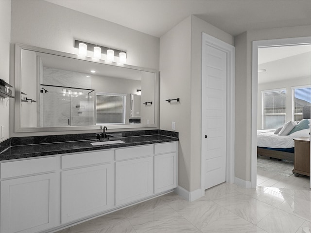 706 Westwood Dr, League City, TX 77573 - bathroom with a shower stall, marble look tiles, vanity, and ensuite bath