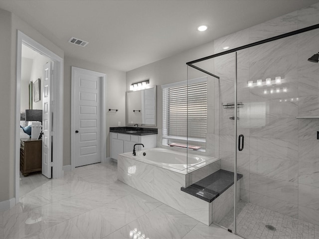 706 Westwood Dr, League City, TX 77573 - bathroom with a garden tub, a stall shower, marble look tiles, vanity, and recessed lighting