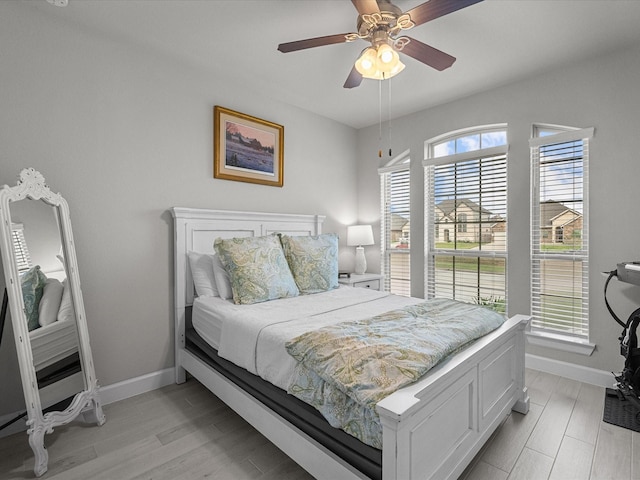 706 Westwood Dr, League City, TX 77573 - bedroom featuring light wood-style floors and a ceiling fan