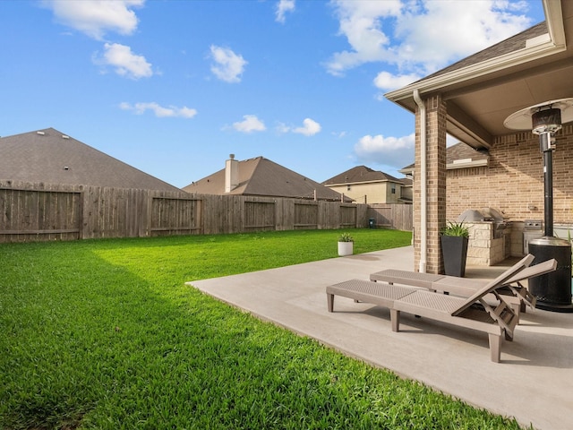 706 Westwood Dr, League City, TX 77573 - fenced backyard with a patio and area for grilling