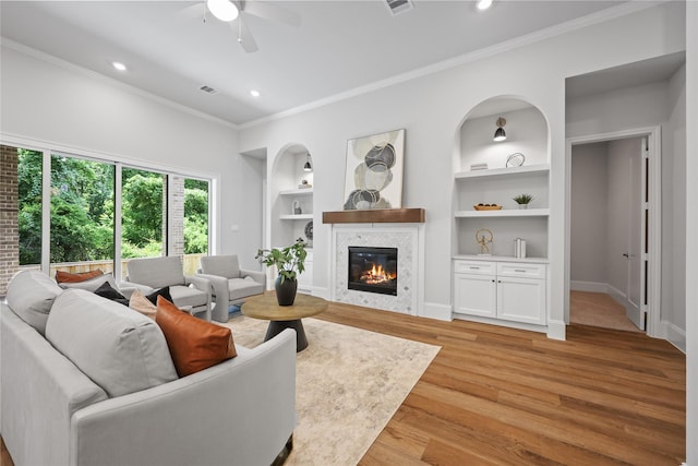 161 Pine Branch Dr, Montgomery, TX 77356 - living area with ceiling fan, crown molding, built in shelves, light wood-style flooring, and recessed lighting