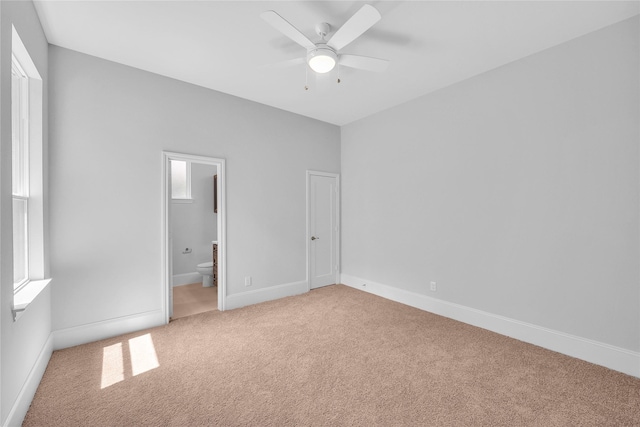 161 Pine Branch Dr, Montgomery, TX 77356 - unfurnished bedroom with light carpet, ensuite bath, and ceiling fan