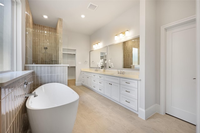 161 Pine Branch Dr, Montgomery, TX 77356 - bathroom featuring double vanity, a soaking tub, walk in shower, and recessed lighting