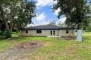 3889 County Road 155, Alvin, TX 77511 - back of property with a yard