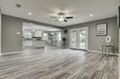 3889 County Road 155, Alvin, TX 77511 - unfurnished living room featuring wood finished floors, recessed lighting, and ceiling fan