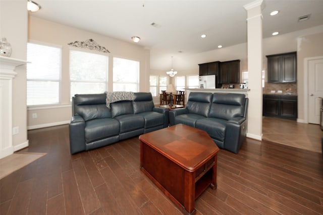 28407 Kinglet Pines Dr, Katy, TX 77494 - living room with plenty of natural light, ornate columns, dark wood-style flooring, and recessed lighting