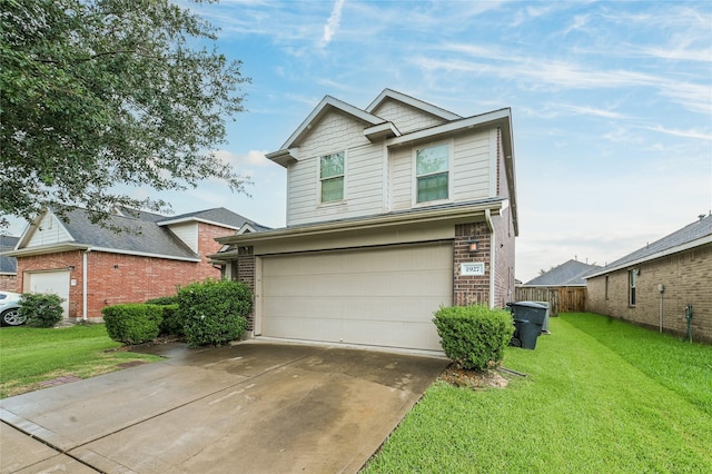 1927 Vermillion View St, Fresno, TX 77545 - traditional-style home featuring an attached garage, a front yard, driveway, and brick siding