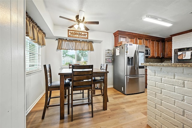 319 Shady Glade Dr, Houston, TX 77090 - dining room with ceiling fan and light wood-style floors