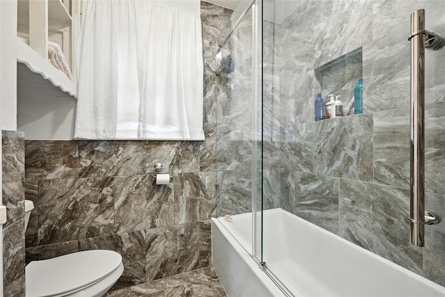 319 Shady Glade Dr, Houston, TX 77090 - bathroom with shower / bath combination with glass door and tile walls