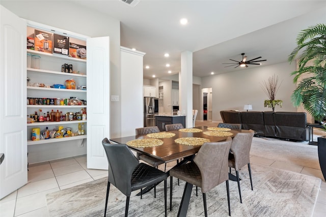 1806 Bridge Gate Ln, Katy, TX 77494 - dining area featuring light tile patterned floors, ceiling fan, and recessed lighting