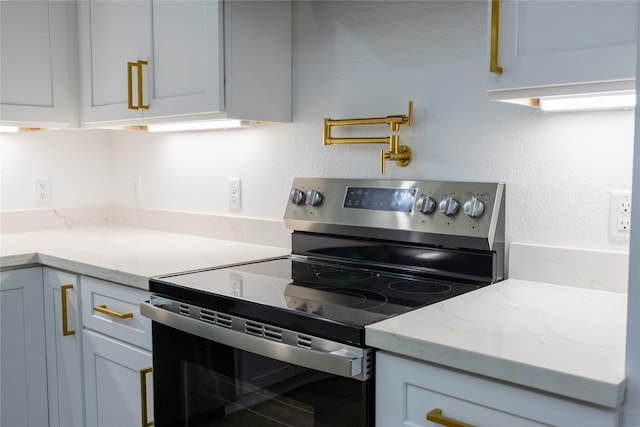 51 V Allen Ln, Coldspring, TX 77331 - kitchen with electric stove and light stone counters