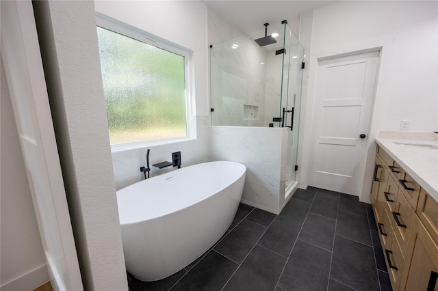 51 V Allen Ln, Coldspring, TX 77331 - full bathroom with a marble finish shower, vanity, a soaking tub, and tile patterned flooring