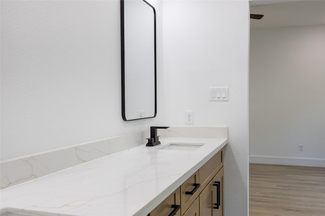 51 V Allen Ln, Coldspring, TX 77331 - bathroom with vanity and wood finished floors