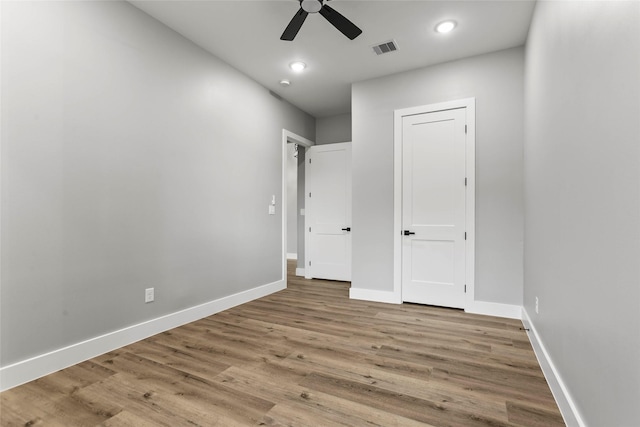 210 Hogan Ln, Hempstead, TX 77445 - unfurnished bedroom featuring wood finished floors, a ceiling fan, and recessed lighting