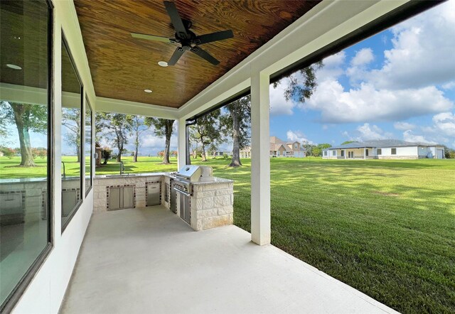 210 Hogan Ln, Hempstead, TX 77445 - view of patio featuring an outdoor kitchen and ceiling fan